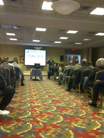 Dwayne Johnson coaching at a leadership conference